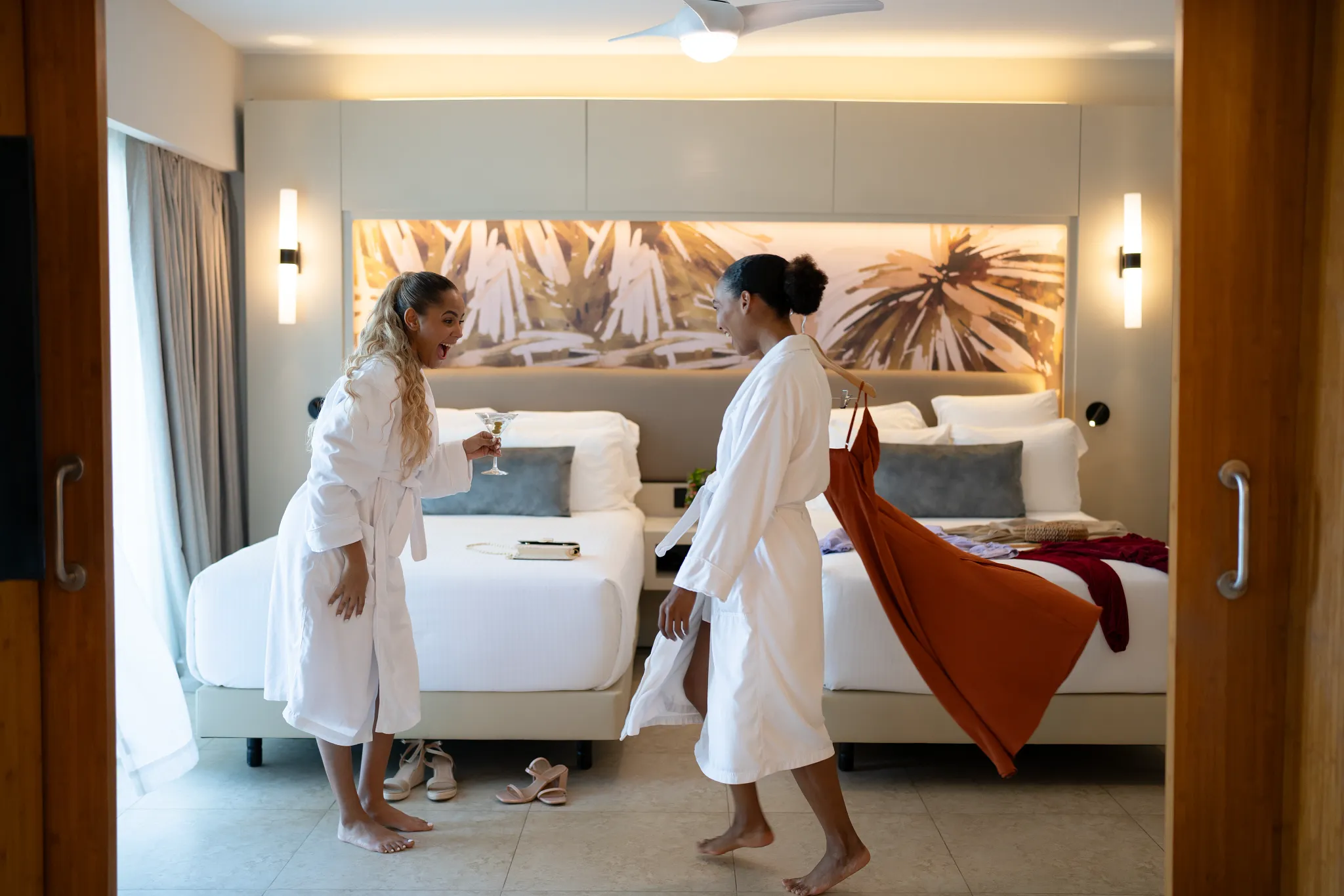 Friends enjoying drinks while relaxing near a private pool area at Breathless Punta Cana.