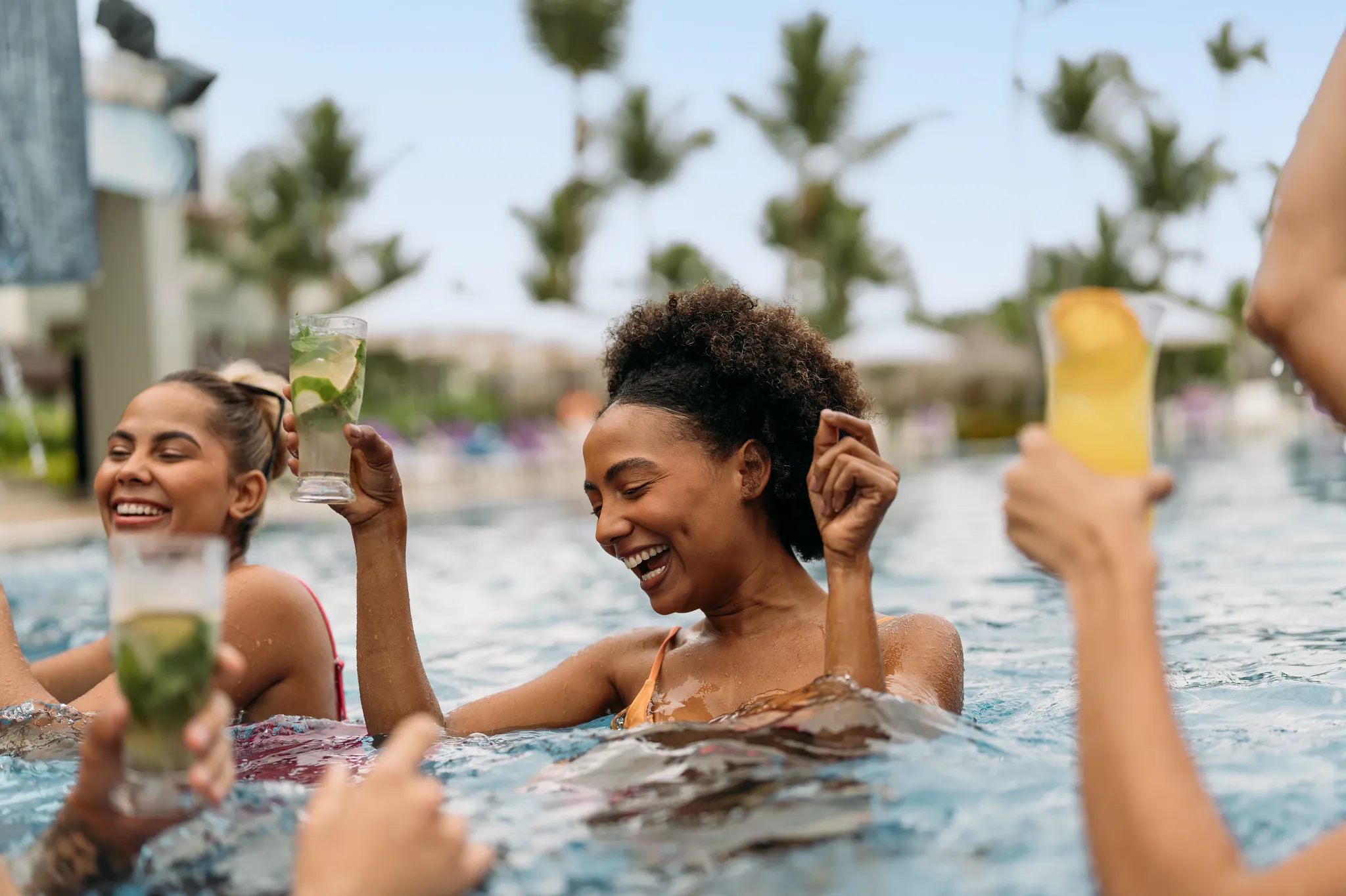 Friends enjoying cocktails together in the pool at Breathless Punta Cana.