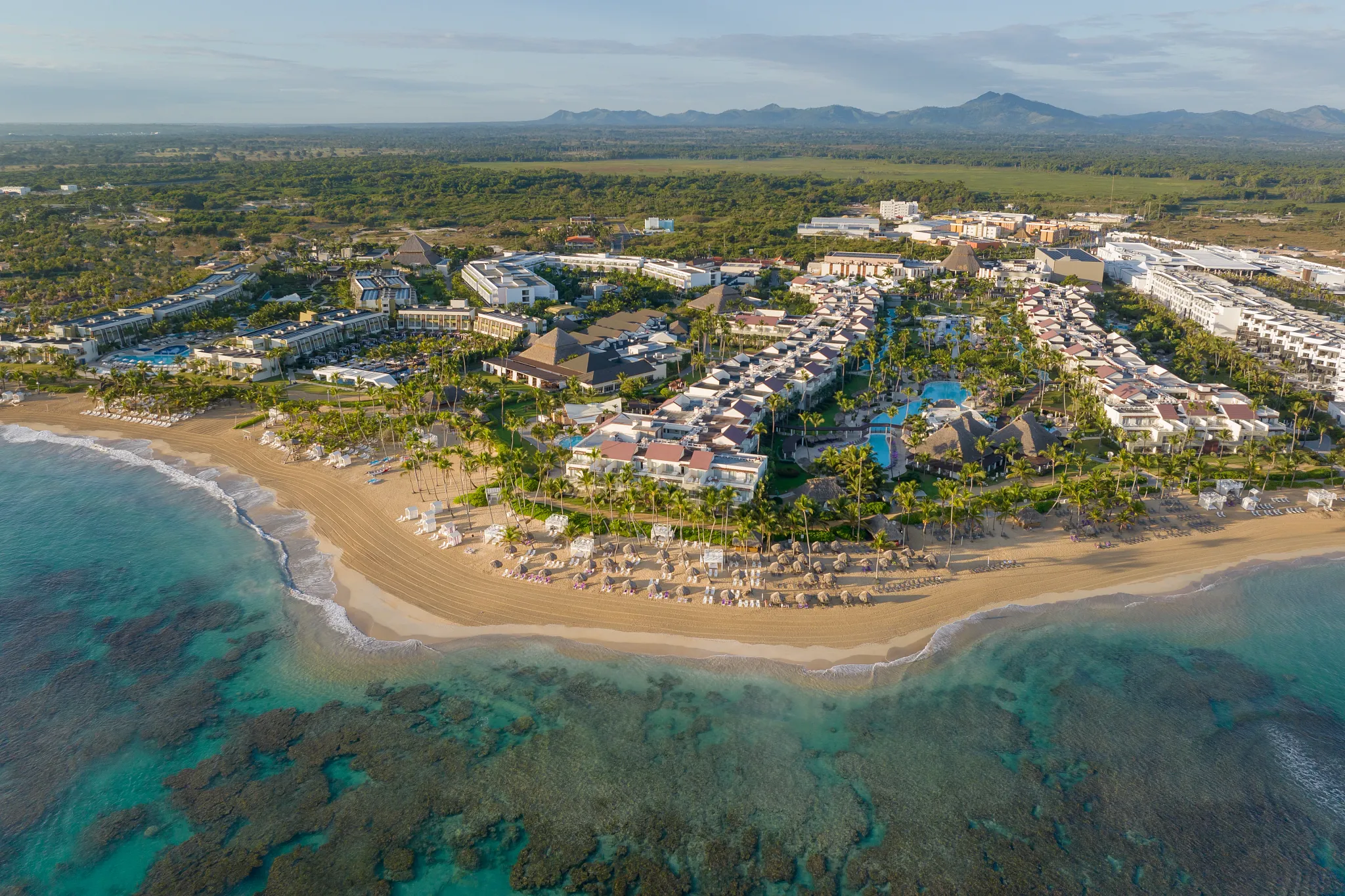 Aerial view of Breathless Punta Cana along the expansive Punta Cana coastline and coral reefs.