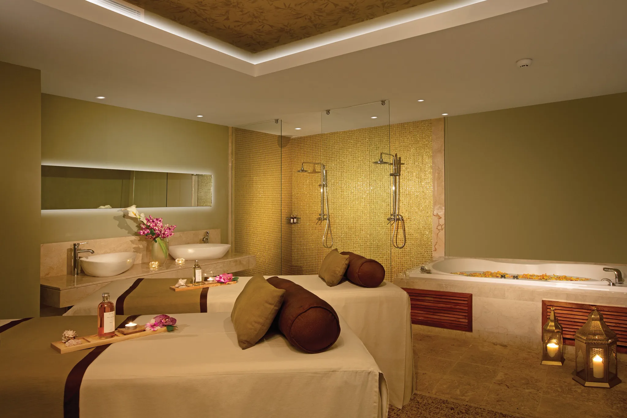 Luxury spa cabin at Breathless Punta Cana with massage tables, soaking tub, and calming décor.