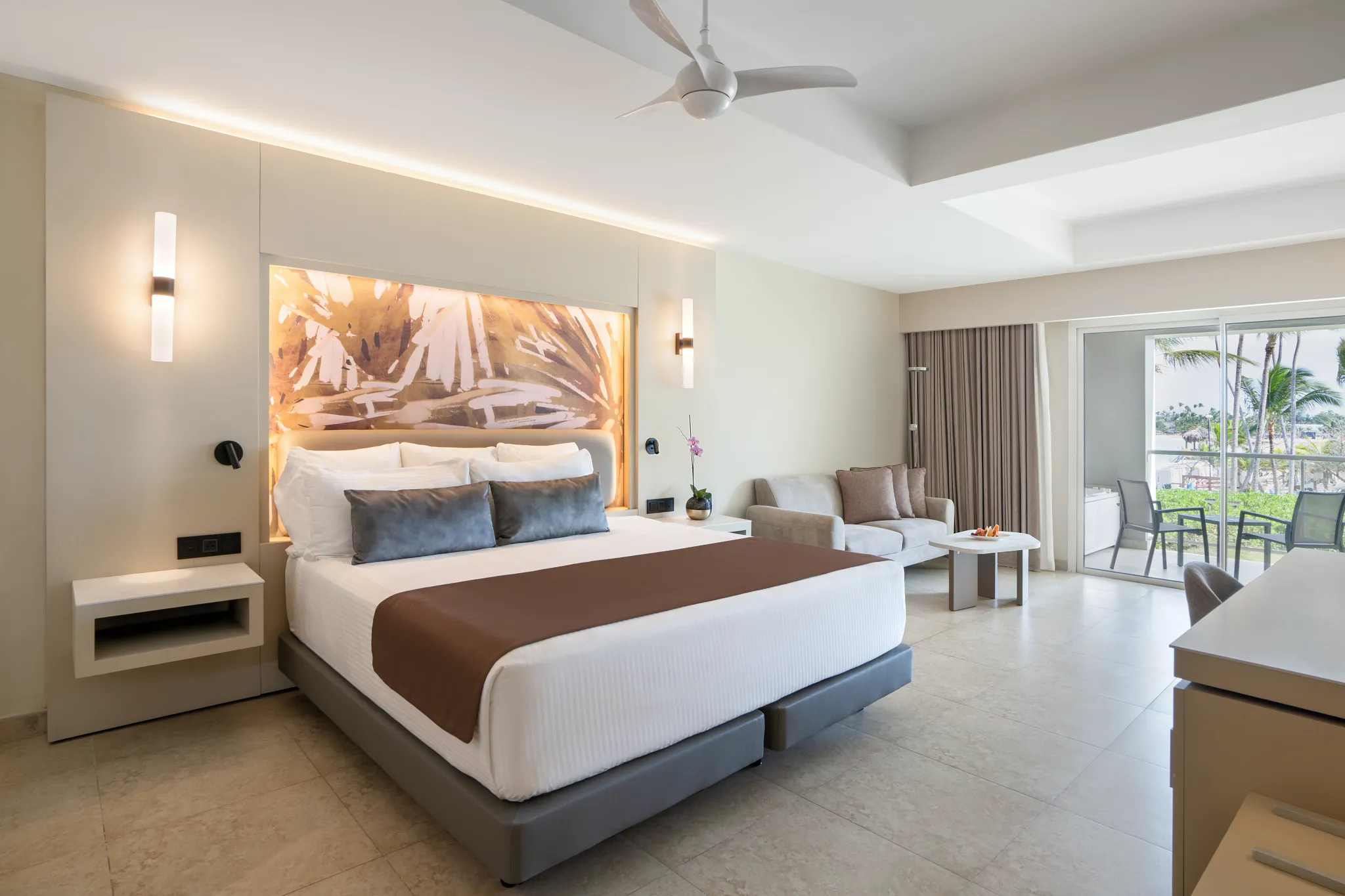 Xhale Club Junior Suite Partial Ocean View with king bed and private terrace overlooking the ocean at Breathless Punta Cana Resort.