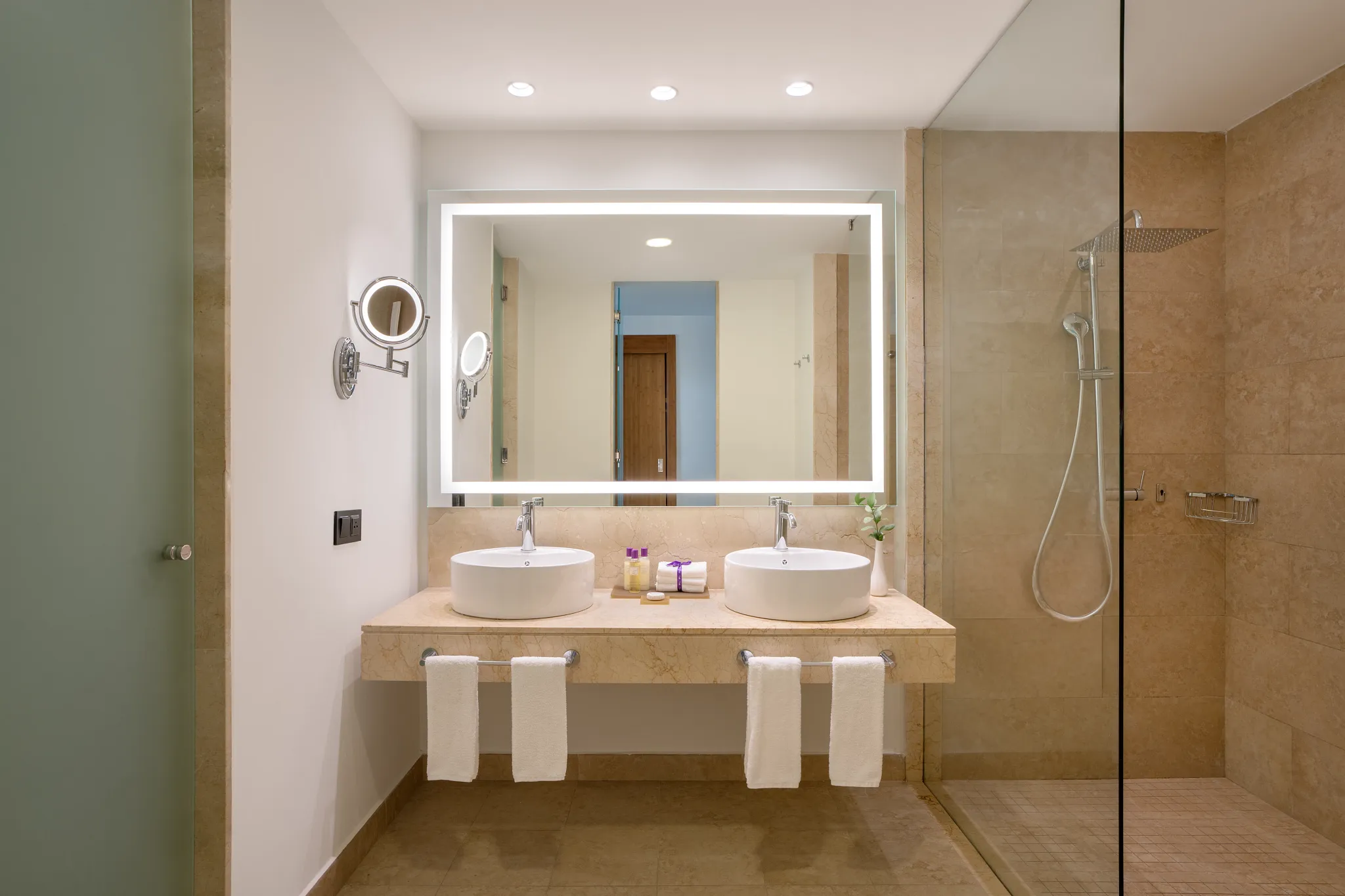 Xhale Club Junior Suite Swim Up bathroom with double vanity and walk-in shower at Breathless Punta Cana Resort.